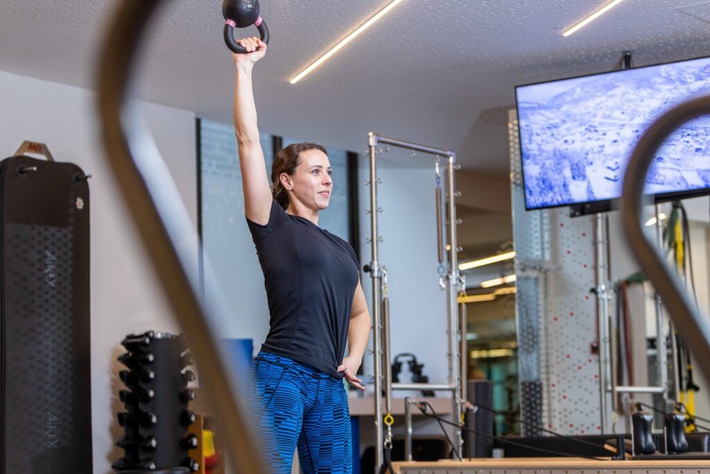 Woman performing upper body exercise